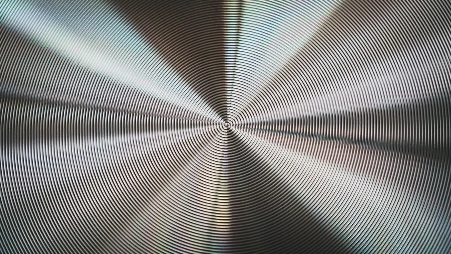 Macro of a guilloché watch dial.