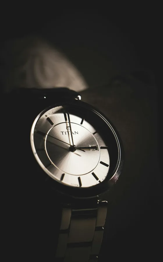 A YELM watch worn against a light-blue sleeve.